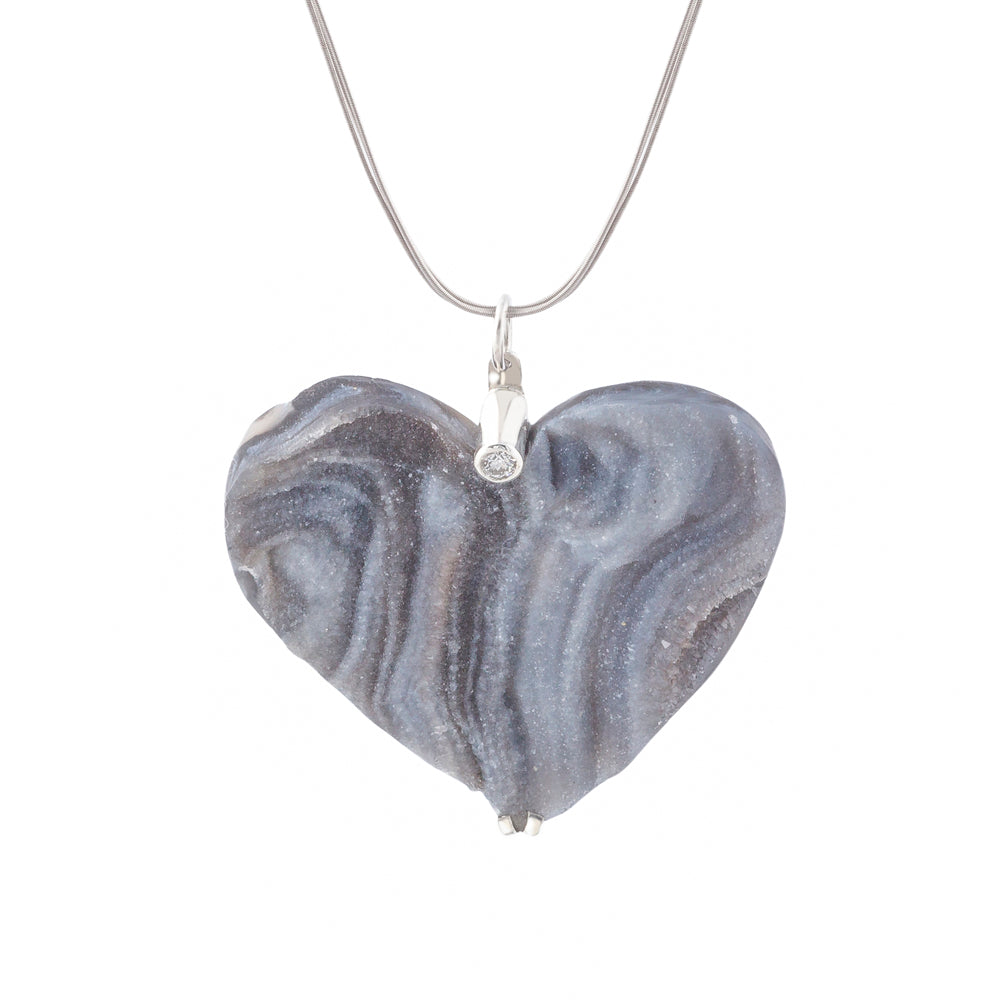 heart shaped stone pendant in grey tones set with solitaire diamond
